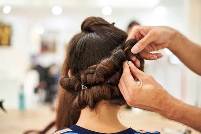 Barber stylist portrait in the salon